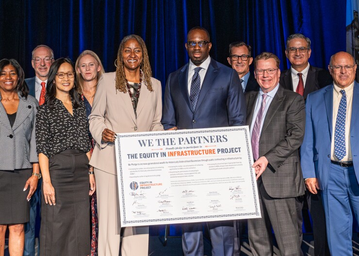 Los Angeles County Supervisor Holly Mitchell and California Transportation Secretary Toks Omishakin (pictured middle) were among the signers of the Equity in Infrastructure project pledge.